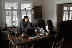 photo of women using laptops